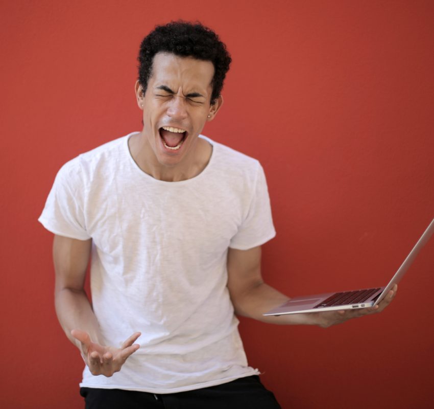 young-ethnic-male-with-laptop-screaming-3799830 young-ethnic-male-with-laptop-screaming-3799830